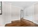 Well-lit bedroom with hardwood floors, large closet, and neutral wall color at 829 Burton St, Rocky Mount, NC 27803
