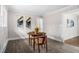 Bright dining area with wood table, chairs, vinyl plank flooring, and natural light at 829 Burton St, Rocky Mount, NC 27803