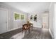 Bright dining area with wood table, chairs, vinyl plank flooring, and natural light at 829 Burton St, Rocky Mount, NC 27803