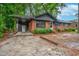 Charming single-story brick house with a cozy carport and well-maintained landscaping at 829 Burton St, Rocky Mount, NC 27803