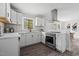 Bright kitchen featuring white cabinetry, stainless steel appliances, and an inviting view at 829 Burton St, Rocky Mount, NC 27803