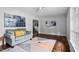 Cozy living room featuring hardwood floors, gray sofa, and modern abstract art at 829 Burton St, Rocky Mount, NC 27803