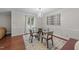 Cozy dining area with a glass table, stylish decor, and ample natural light at 8509 Oneal Rd, Raleigh, NC 27613