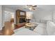 Open living space with a cozy fireplace, hardwood floors, and comfortable seating at 8509 Oneal Rd, Raleigh, NC 27613