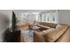 Spacious living room featuring hardwood floors, a comfortable sectional, and lots of natural light at 8509 Oneal Rd, Raleigh, NC 27613