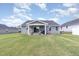 Spacious backyard with a covered patio and outdoor seating, ideal for relaxing and entertaining at 8615 Kenridge Ln, Fuquay Varina, NC 27526