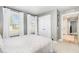 Calm bedroom with neutral walls, plenty of natural light, and closet, and a view to the hall at 8615 Kenridge Ln, Fuquay Varina, NC 27526