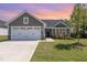 Charming single-Gathering home boasting a well-manicured lawn and an inviting front entrance at 8615 Kenridge Ln, Fuquay Varina, NC 27526