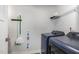 Functional laundry room showcasing a new washer and dryer, storage, and space-saving organizers at 8615 Kenridge Ln, Fuquay Varina, NC 27526