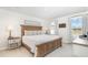 Cozy main bedroom features a wooden bed frame, side tables, and plenty of natural light at 8615 Kenridge Ln, Fuquay Varina, NC 27526
