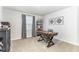 Bright office space featuring a wooden desk, decor, a bookshelf, and a window offering natural light at 8615 Kenridge Ln, Fuquay Varina, NC 27526