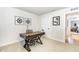 Well-lit office area boasting stylish decor, a modern desk, and an adjacent hallway at 8615 Kenridge Ln, Fuquay Varina, NC 27526