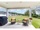 Relaxing covered patio with outdoor seating, overlooking a spacious green lawn at 8615 Kenridge Ln, Fuquay Varina, NC 27526