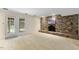 Finished basement with brick fireplace and walk-out access at 1000 Winona Rd, Raleigh, NC 27609