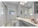 Updated bathroom with glass shower, bright vanity and modern fixtures at 1000 Winona Rd, Raleigh, NC 27609
