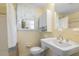 Bathroom with a pedestal sink, a window, and shower at 1000 Winona Rd, Raleigh, NC 27609