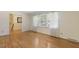 Inviting bedroom with hardwood floors, large window with ample natural light, and neutral wall paint at 1000 Winona Rd, Raleigh, NC 27609