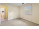 Bedroom with carpet, natural light, and en-suite bathroom access at 1000 Winona Rd, Raleigh, NC 27609