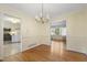 Traditional dining room with chandelier and hardwood floors at 1000 Winona Rd, Raleigh, NC 27609