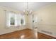 Well-lit dining area with natural light and hardwood flooring at 1000 Winona Rd, Raleigh, NC 27609