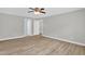 Spacious bedroom with new floors, neutral paint, and a ceiling fan at 1003 Wicksteed Ct, Apex, NC 27502