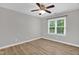Bright bedroom featuring new floors and view from light-filled windows at 1003 Wicksteed Ct, Apex, NC 27502