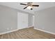 This bedroom has new floors, a ceiling fan, and a double door closet at 1003 Wicksteed Ct, Apex, NC 27502