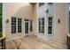 Wooden deck outside the home with multiple windows providing natural light to the home at 1003 Wicksteed Ct, Apex, NC 27502