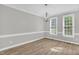 This dining room offers ample natural light, modern lighting fixture, and neutral paint to be personalized to your liking at 1003 Wicksteed Ct, Apex, NC 27502