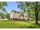 Beautiful home with large yard, wooden deck, and lots of green trees at 1003 Wicksteed Ct, Apex, NC 27502