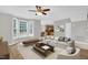 Inviting living room with hardwood floors and bay window providing great natural light at 1003 Wicksteed Ct, Apex, NC 27502