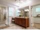 Bathroom with double vanity, granite counters, walk-in shower, and large mirror at 101 Temple Gate Dr, Cary, NC 27518