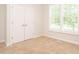 Bedroom with double door closet, carpet and natural light at 101 Temple Gate Dr, Cary, NC 27518