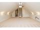 Large bonus room with a projector and stair access at 101 Temple Gate Dr, Cary, NC 27518