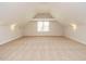 Expansive bonus room with carpet and lots of windows at 101 Temple Gate Dr, Cary, NC 27518