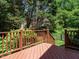 Wooden deck overlooks the lawn and landscaped backyard at 101 Temple Gate Dr, Cary, NC 27518