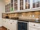 Stylish dining area with custom cabinets, wine cooler and serving counter at 101 Temple Gate Dr, Cary, NC 27518