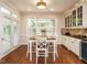 Charming breakfast nook with hardwood floors, built-in cabinets and plenty of natural light at 101 Temple Gate Dr, Cary, NC 27518