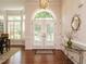 Bright foyer with hardwood floors, double doors, and stylish decor creating a welcoming entrance at 101 Temple Gate Dr, Cary, NC 27518