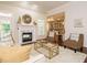 Open-concept living room with fireplace and view of the kitchen; great for entertaining at 101 Temple Gate Dr, Cary, NC 27518