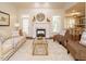 Bright living room with fireplace and comfortable seating, offering a welcoming and stylish space for relaxation at 101 Temple Gate Dr, Cary, NC 27518
