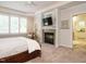 Spacious main bedroom with fireplace, plantation shutters, and en-suite bathroom at 101 Temple Gate Dr, Cary, NC 27518