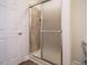 Bathroom stall shower is enclosed with a translucent sliding door at 101 Temple Gate Dr, Cary, NC 27518