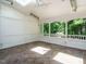 Sunroom with view of trees and a ceiling fan to help keep cool during the warmer months at 101 Temple Gate Dr, Cary, NC 27518