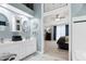 Bathroom with a double vanity, a white countertop, and a glimpse into the connected main bedroom at 103 Uxbridge Ct, Cary, NC 27513