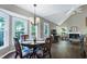 Vaulted ceilings enhance the dining area that opens to the living room at 103 Uxbridge Ct, Cary, NC 27513