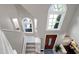Bright foyer boasts large arched windows above the front door, providing lots of natural light from the second story at 103 Uxbridge Ct, Cary, NC 27513