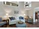 Relax in the living room offering stylish decor, natural light and a calming ambiance at 103 Uxbridge Ct, Cary, NC 27513