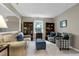 Cozy living room with plush seating, bookshelves, and natural light at 103 Uxbridge Ct, Cary, NC 27513