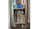 Stainless steel refrigerator features a water and coffee dispenser at 103 Uxbridge Ct, Cary, NC 27513